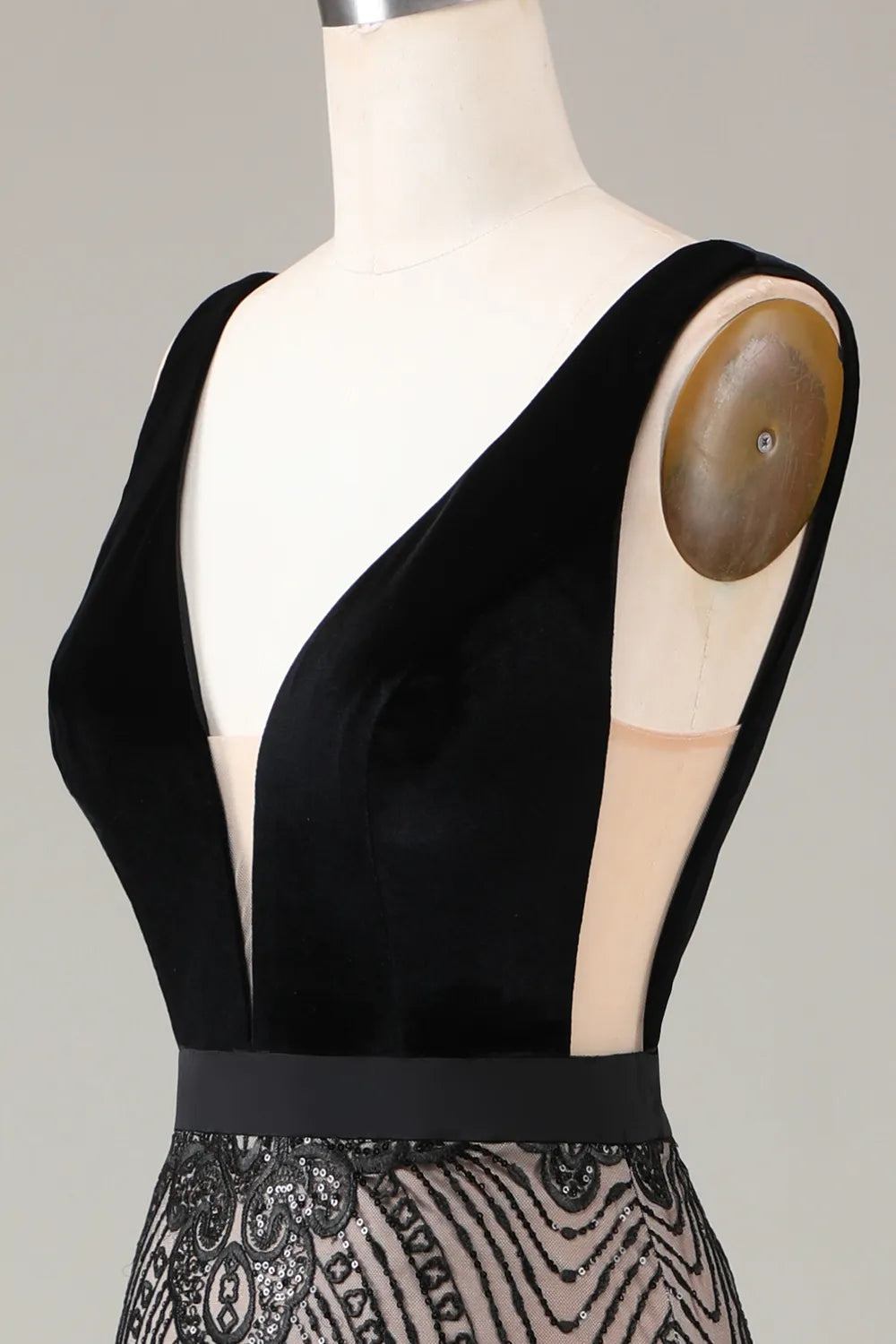 Detail of the shimmering fabric and beadwork on the formal dress.