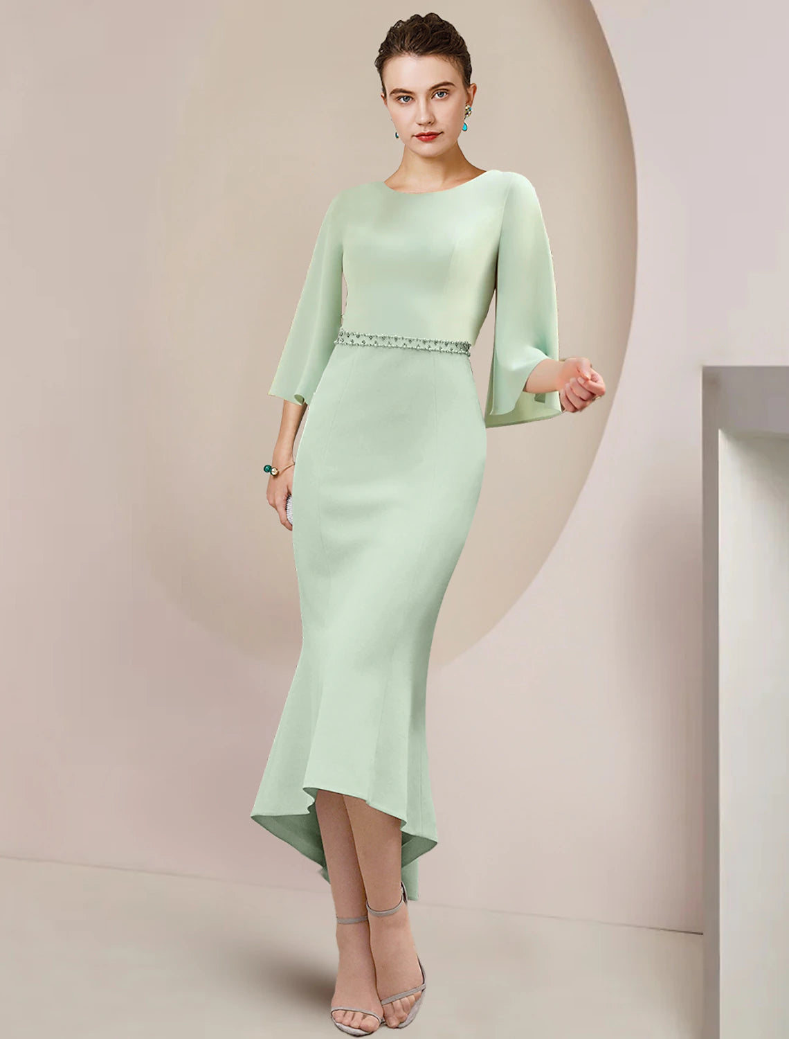 Elegant mermaid trumpet tea length dress with beading.