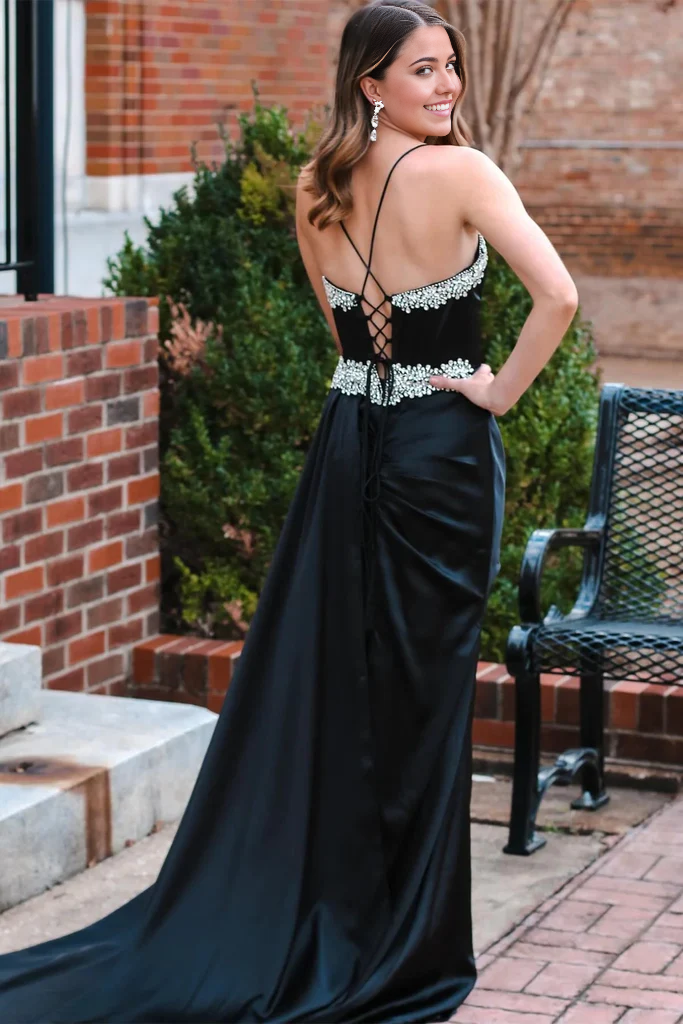 Close-up of intricate beading on the V-neck of a prom dress.