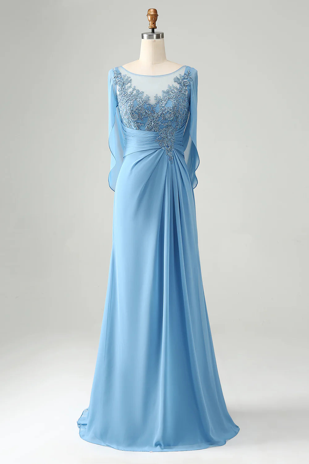Elegant woman wearing a blue mermaid V-neck mother of the bride dress with intricate beading and a matching shawl.