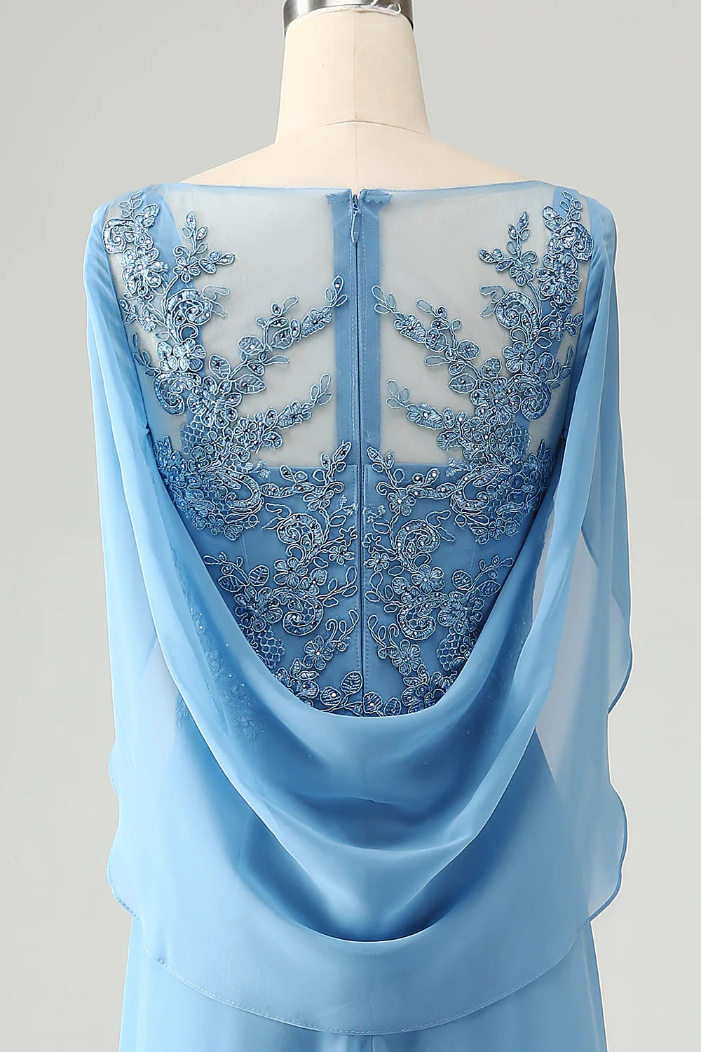 Woman posing in the blue mermaid V-neck dress, demonstrating the fit and the matching shawl.