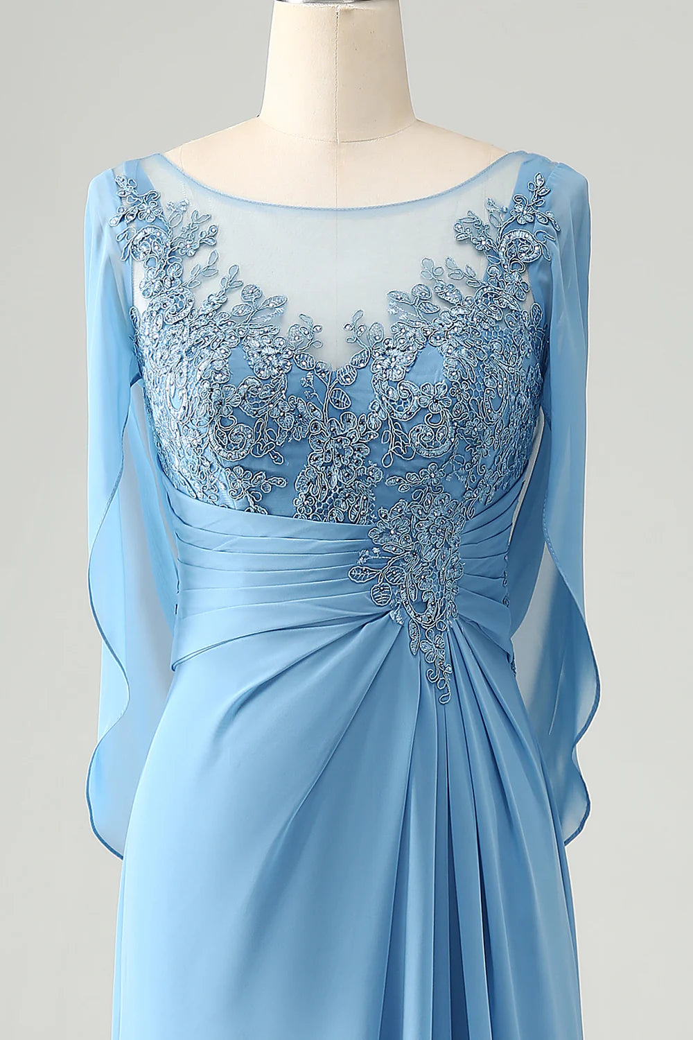 Full-length view of the blue mermaid dress, emphasizing its elegant design and the accompanying shawl.