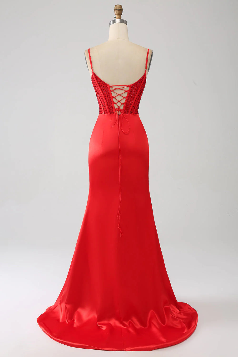 Back view of a red mermaid formal gown with intricate beading.