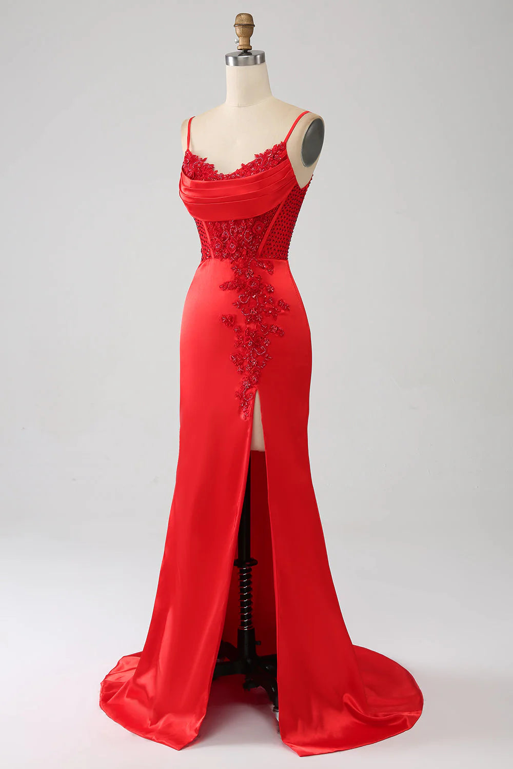 Side view of a model in a red beaded mermaid dress.