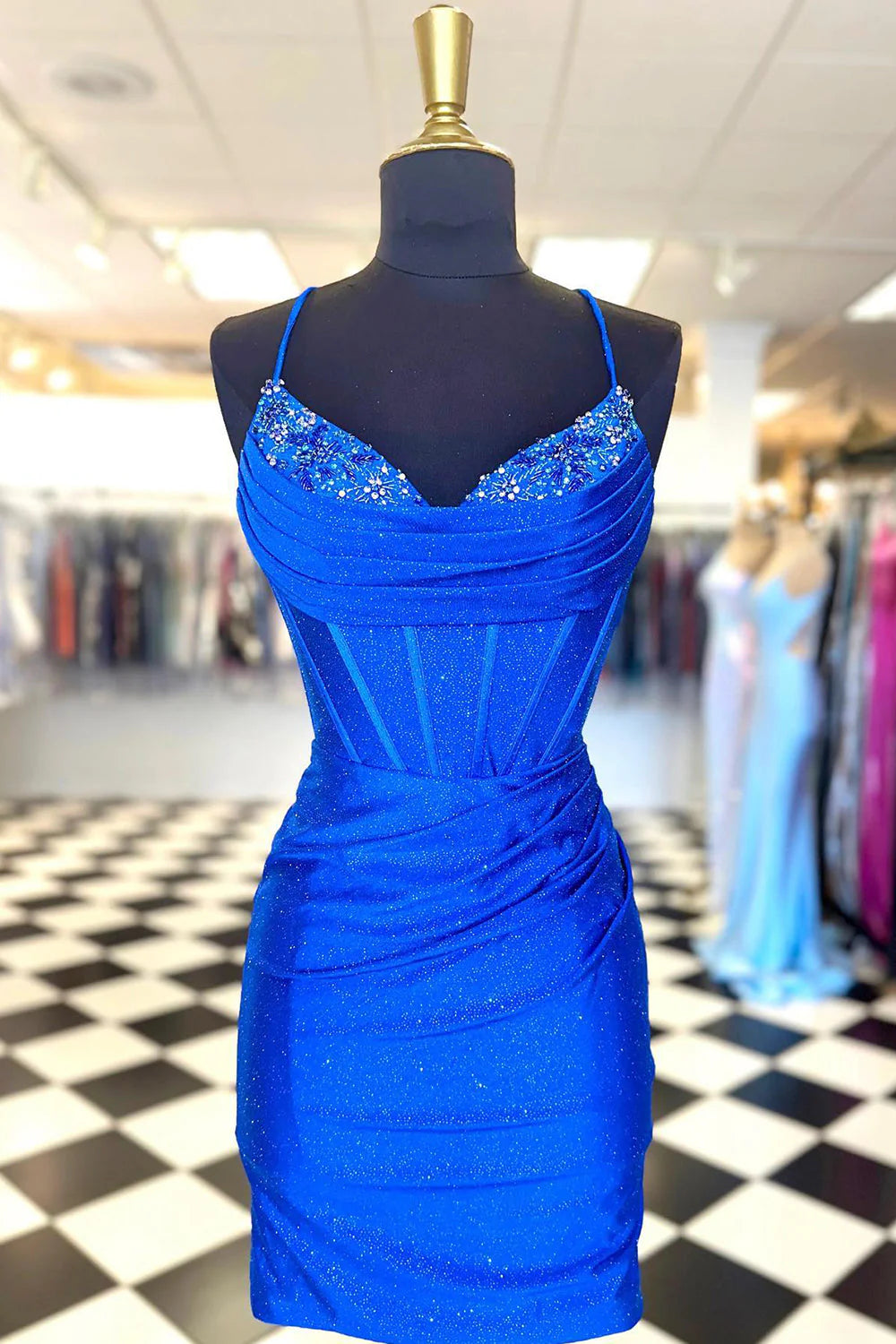 Elegant beaded sheath dress with V-neckline and short length, perfect for homecoming.