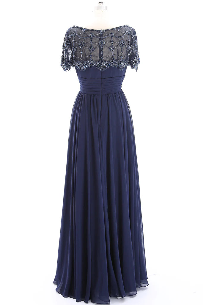 Side view of a beaded short sleeve formal gown.