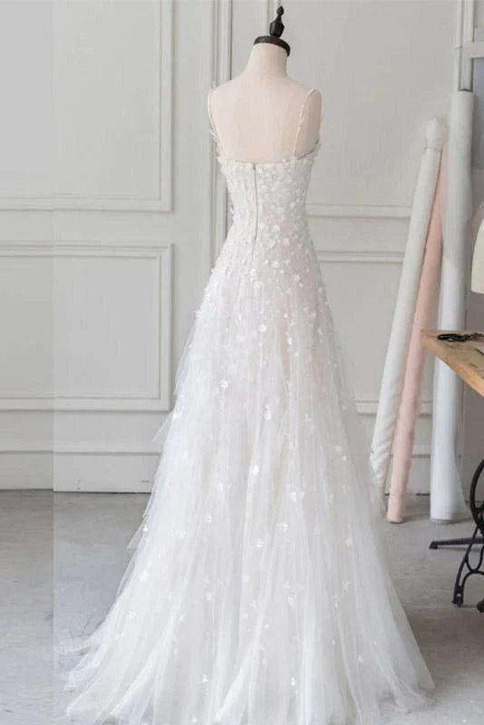 Back view of a floor-length tulle prom gown with delicate beading.