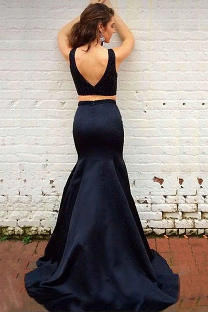 Back view of the black two-piece mermaid prom dress featuring a sweep train.