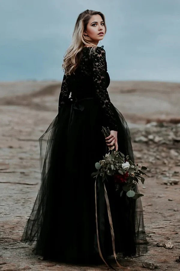 Side view of a black A-line bridal gown showcasing lace details.