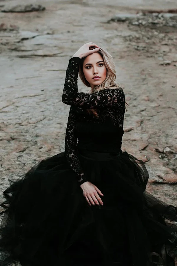 Close-up of the lace appliques on the black bridal gown.