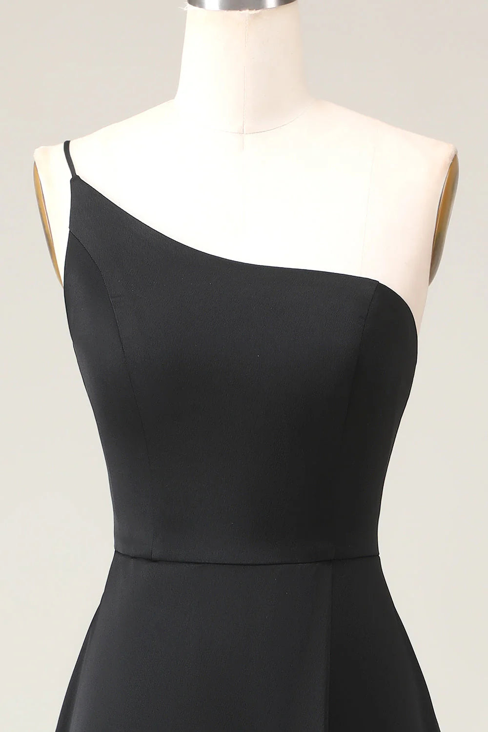 Black A-line chiffon one-shoulder bridesmaid dress, back view showing elegant drape.