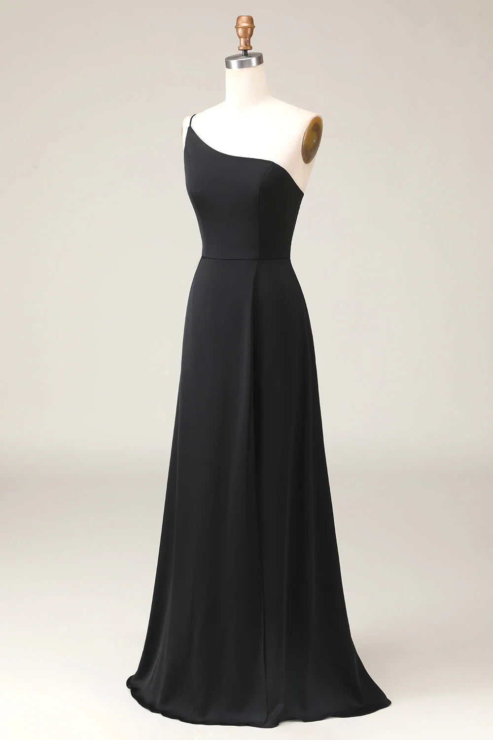 Black A-line chiffon one-shoulder bridesmaid dress, close-up of bodice and shoulder detail.
