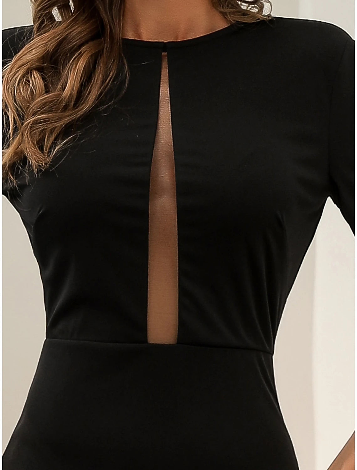 Full length view of a black mermaid trumpet dress for formal occasions.