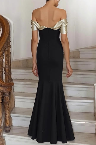 Side view of a black satin off-shoulder mermaid formal gown.