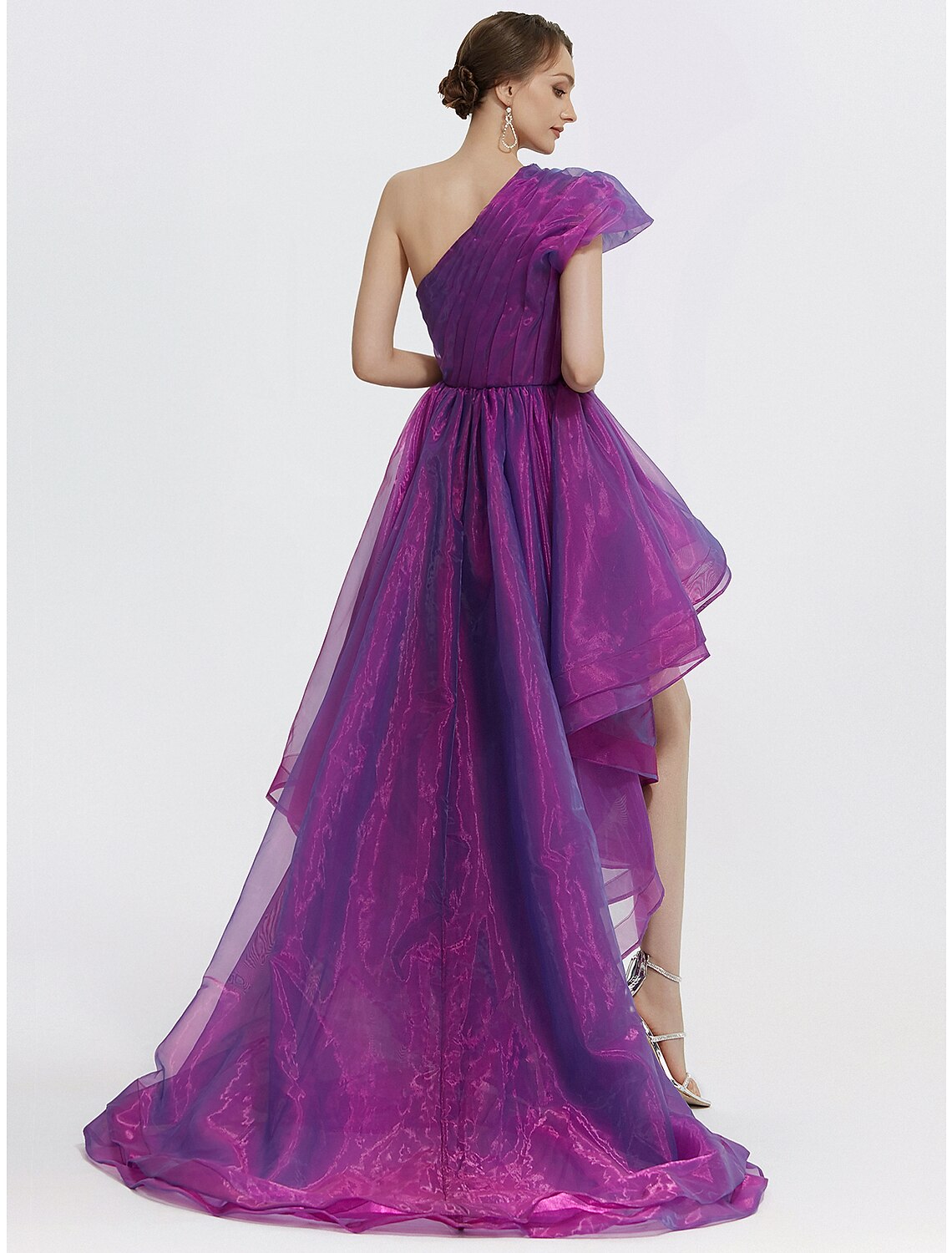 Side view of the black sheath formal dress with feather detail.