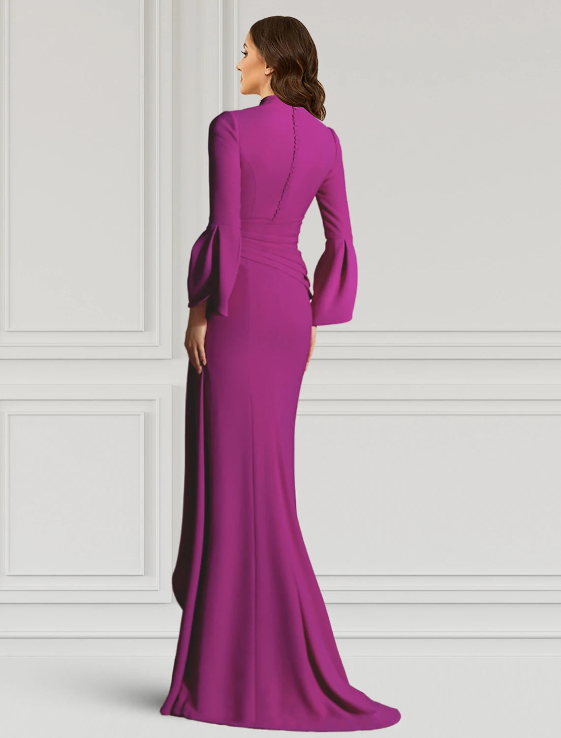 Black floor-length formal dress with ruffled details, side view.