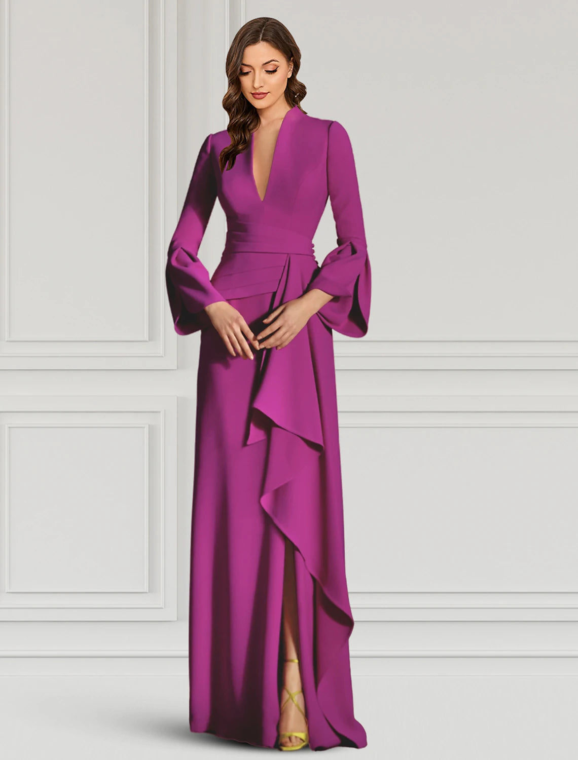 Close-up of the V-neckline and long sleeves on the black sheath dress.