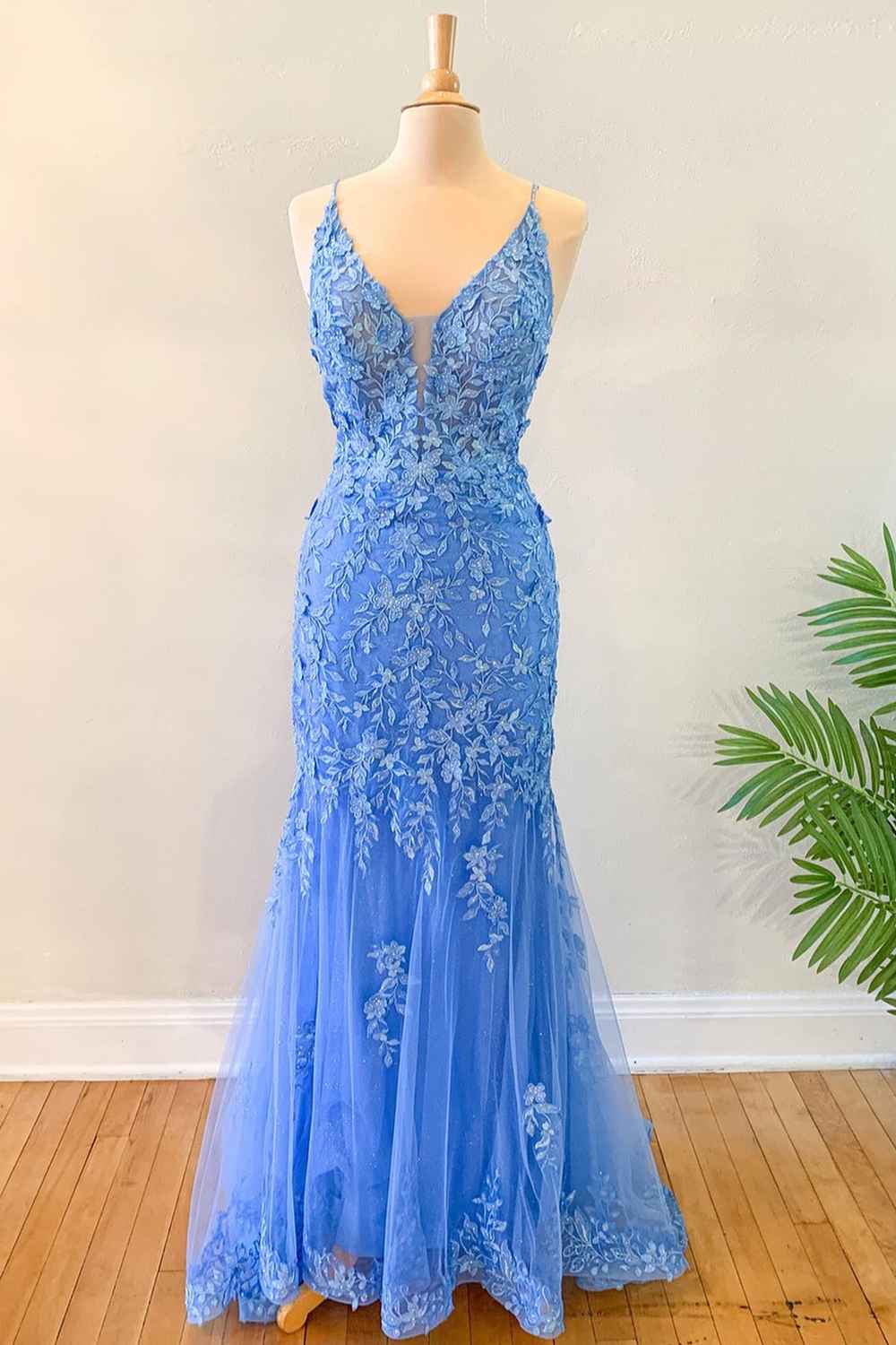 Elegant blue mermaid prom dress with floral lace appliques.