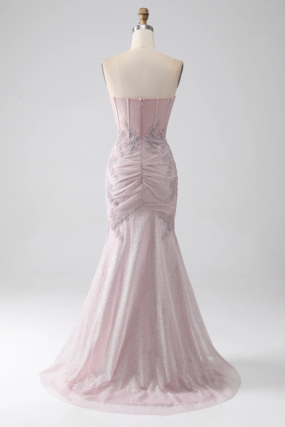 Side view of blush mermaid prom dress, highlighting the silhouette.