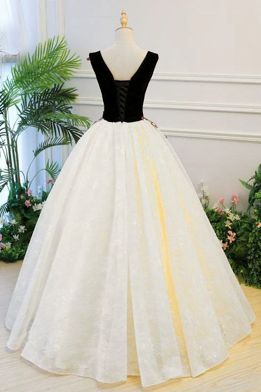 Close-up of the delicate lace appliques and V-neckline on the blush Quinceanera dress.