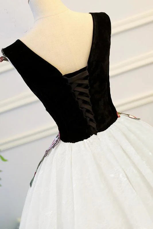 Side view of the flowing skirt and intricate lace details of the blush Quinceanera gown.