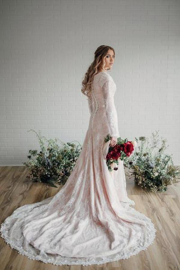 Back view of a bodycon long sleeve lace wedding gown.