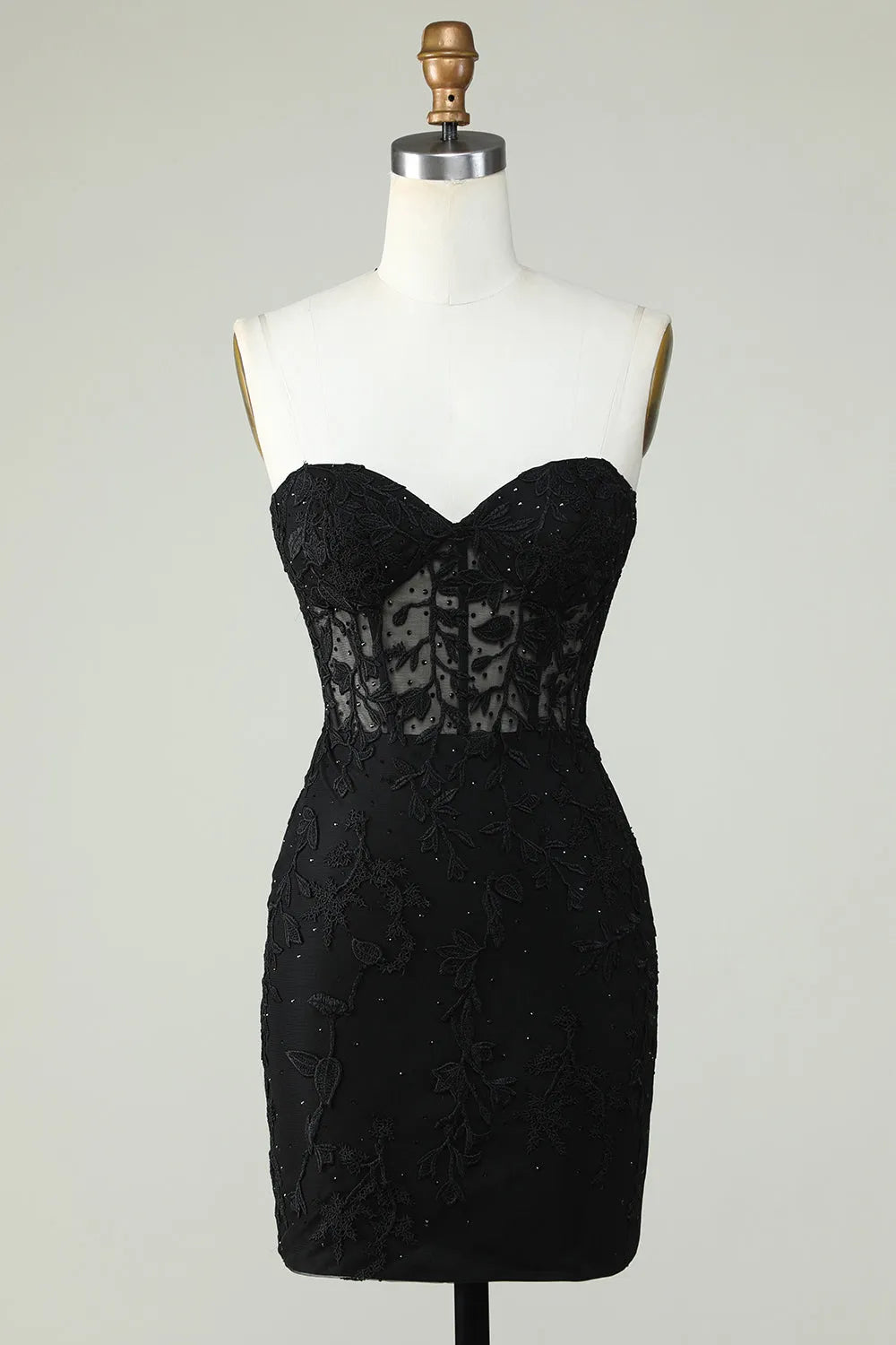 Back view of model in a purple bodycon sweetheart corset dress with appliques.