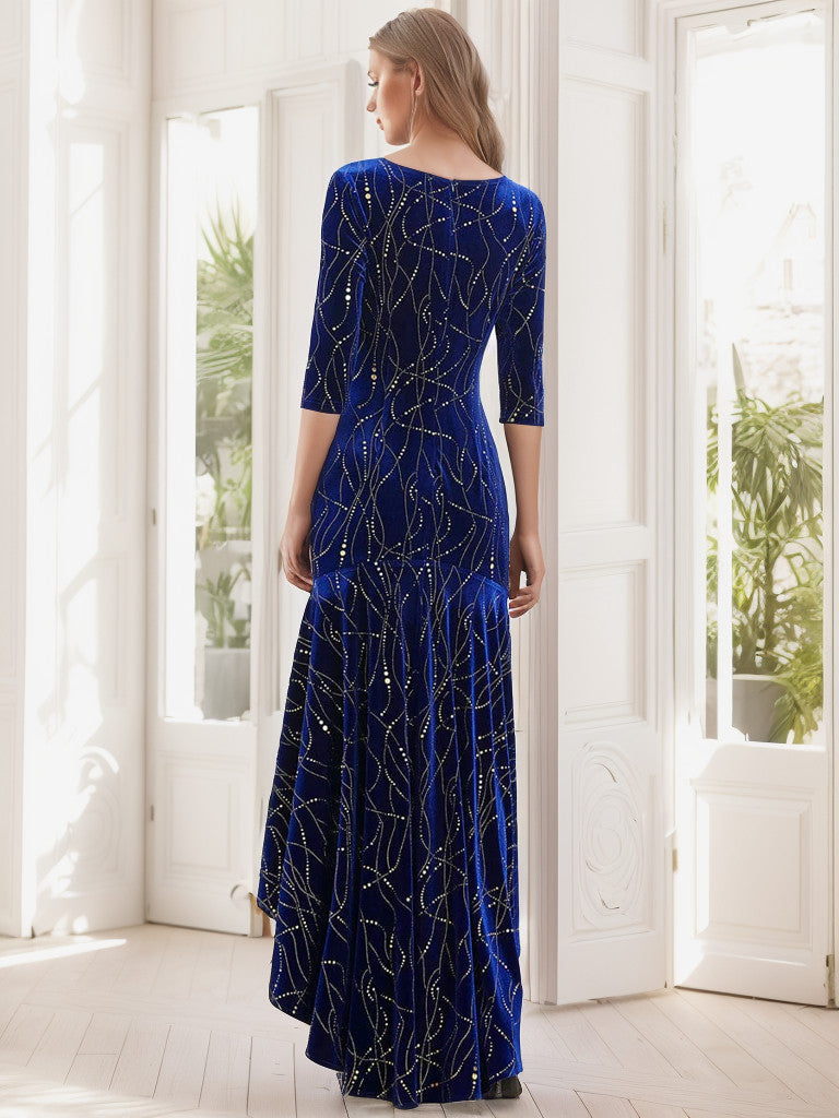 Side view of a woman in a royal blue velvet high-low party dress.