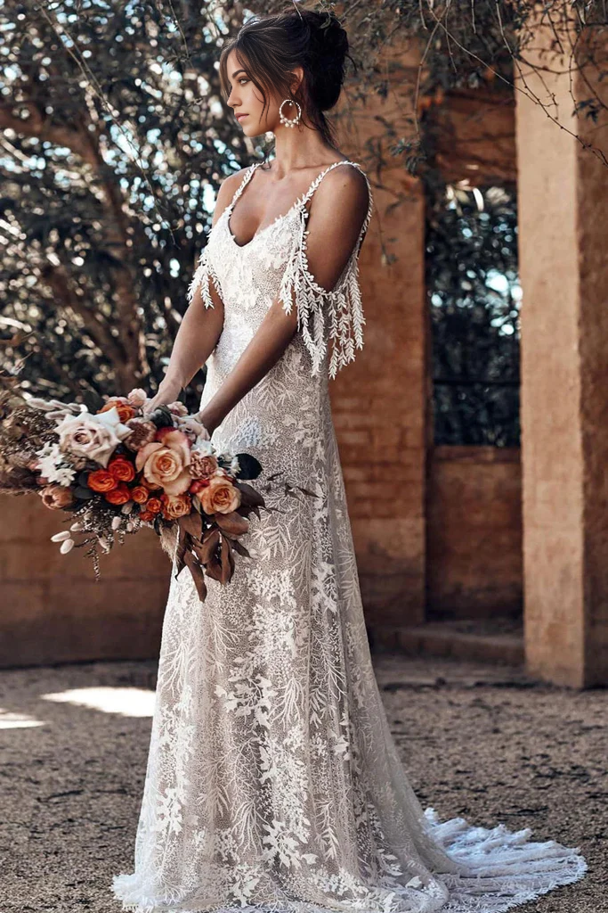 Back view of an ivory backless mermaid wedding dress.