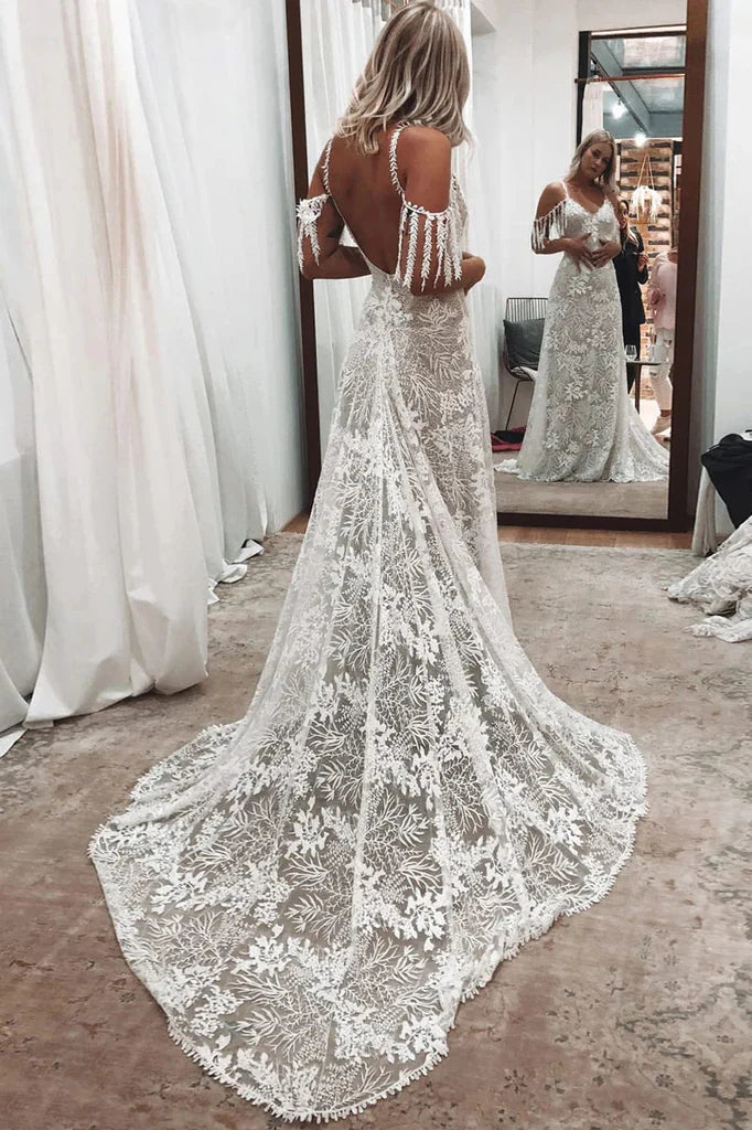 Side view of an elegant ivory mermaid wedding dress.
