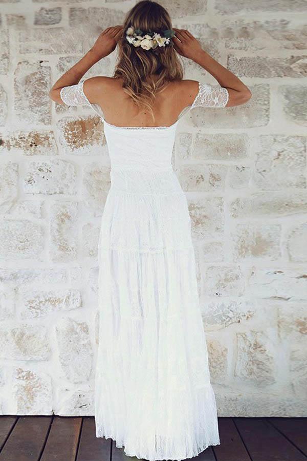 Bride wearing an elegant off-shoulder A-line lace wedding gown.