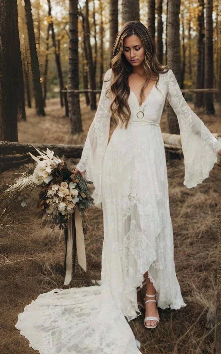 Boho A-line V-neck long sleeve lace wedding dress with sweep train.
