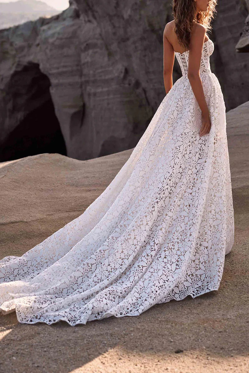 Close-up of the lace detail on a strapless A-line wedding dress.