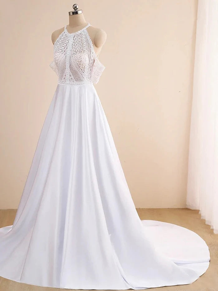 Close-up of the lace detail on an off-shoulder bridal gown.