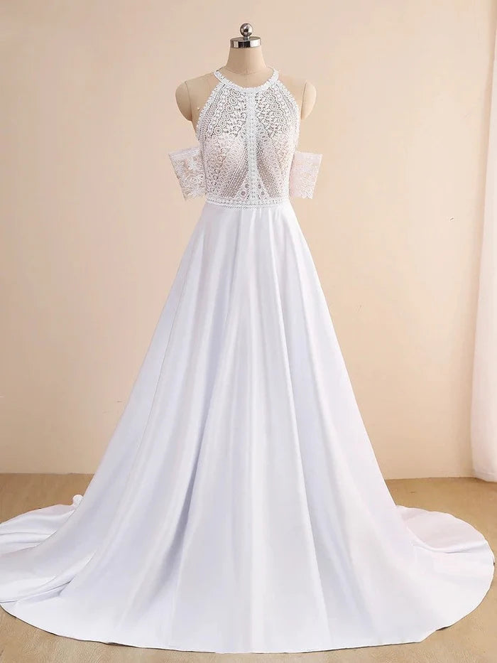 Full view of a woman in a casual off-shoulder lace wedding dress.
