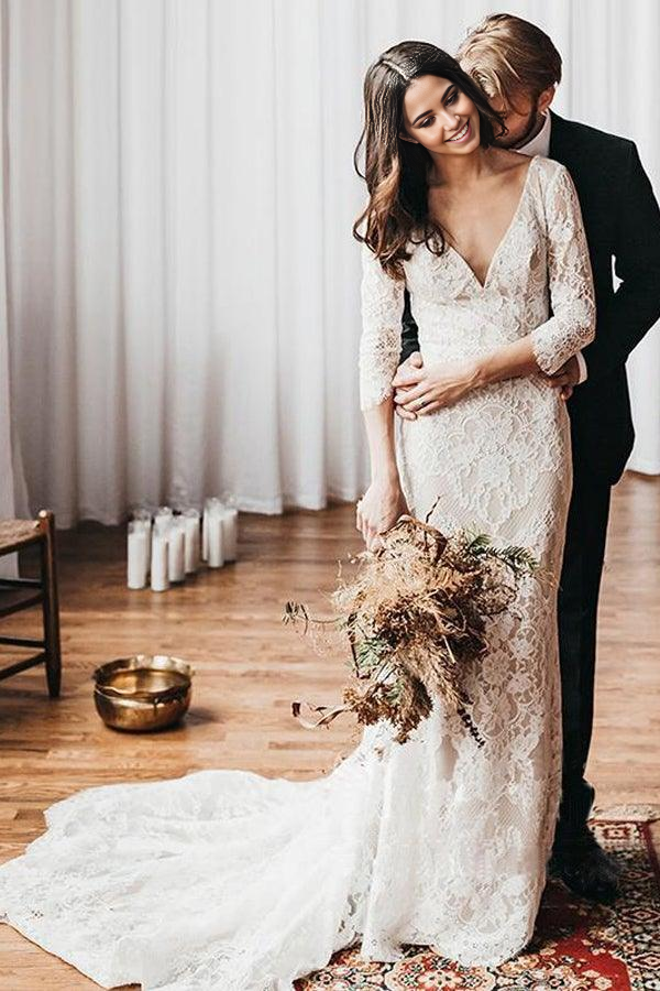 Full view of a bride wearing a Boho Mermaid Lace V-Neck Wedding Dress with a court train.