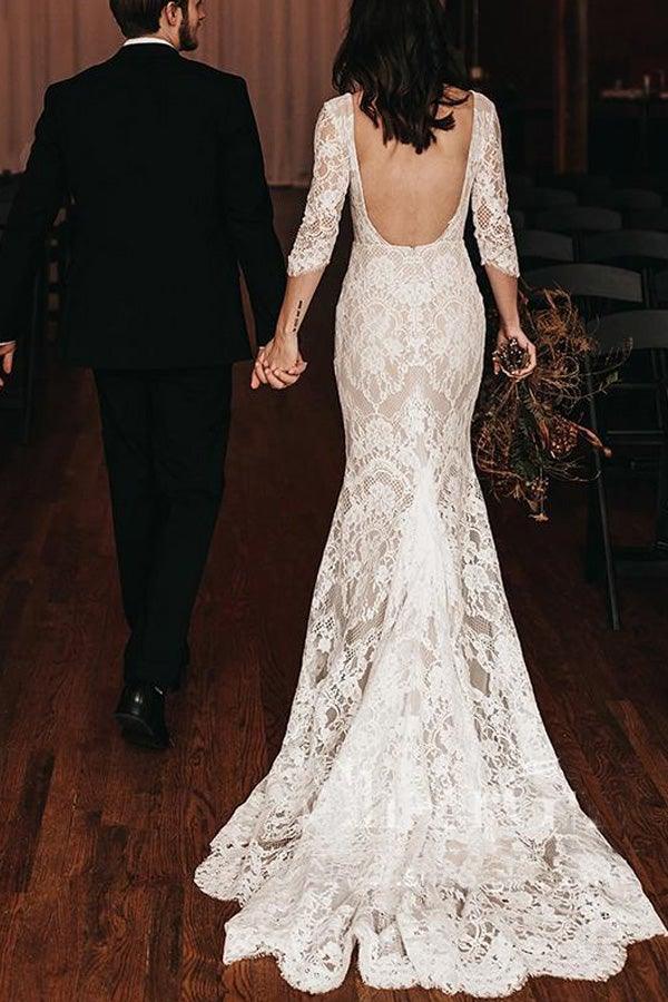 Close-up of the delicate lace and V-neckline on the wedding dress.