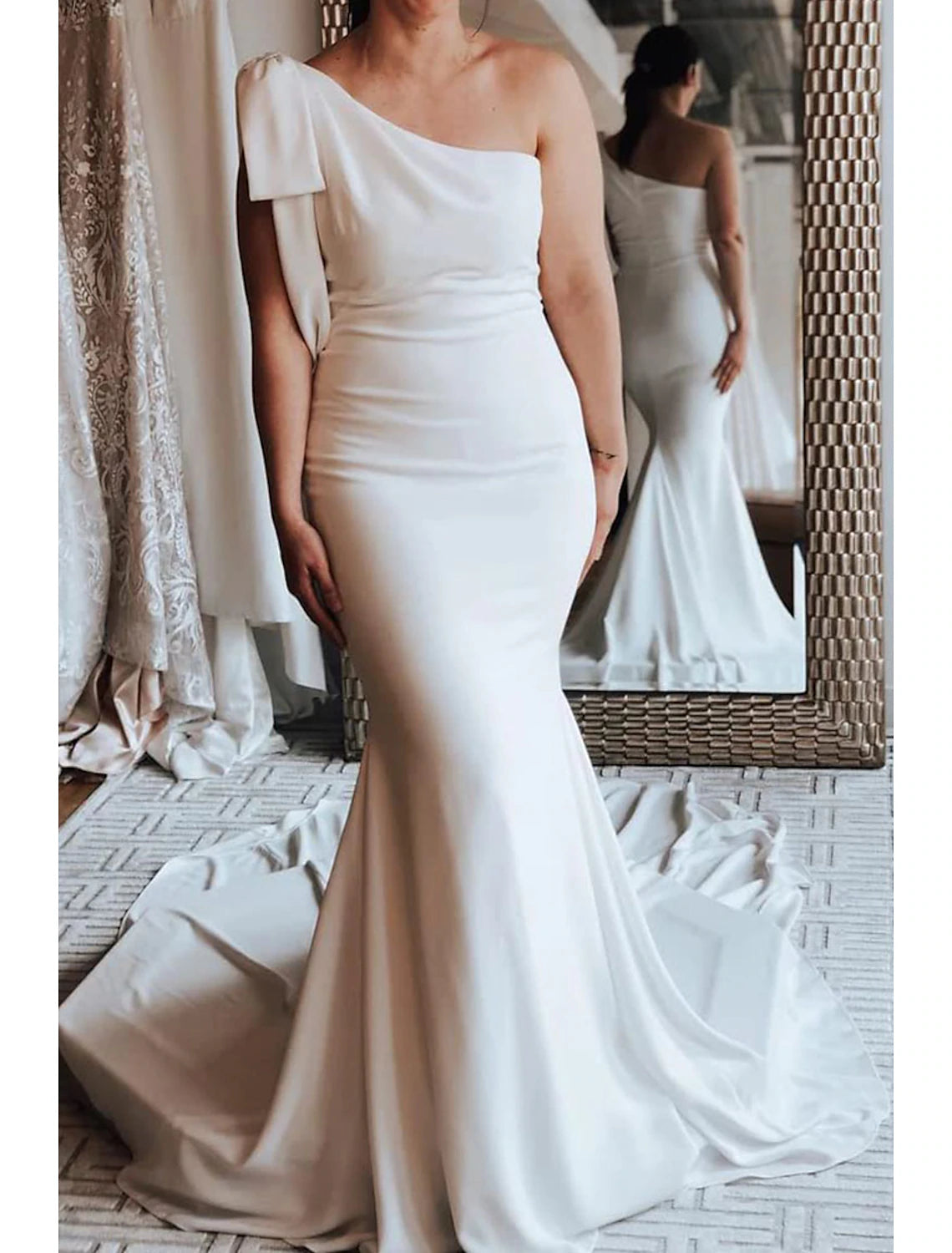 Side view of the Boho Mermaid bridal gown, highlighting the one-shoulder design.
