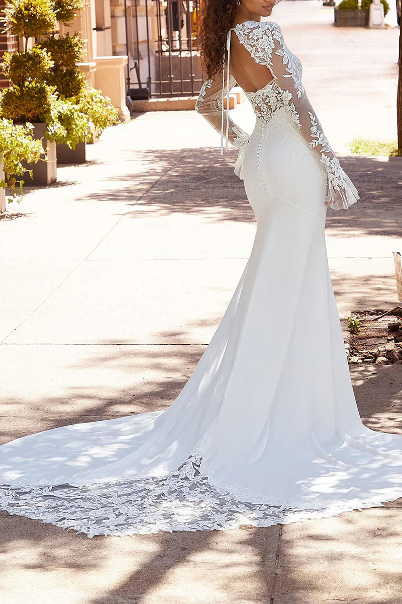 Back view of an elegant mermaid bridal gown.