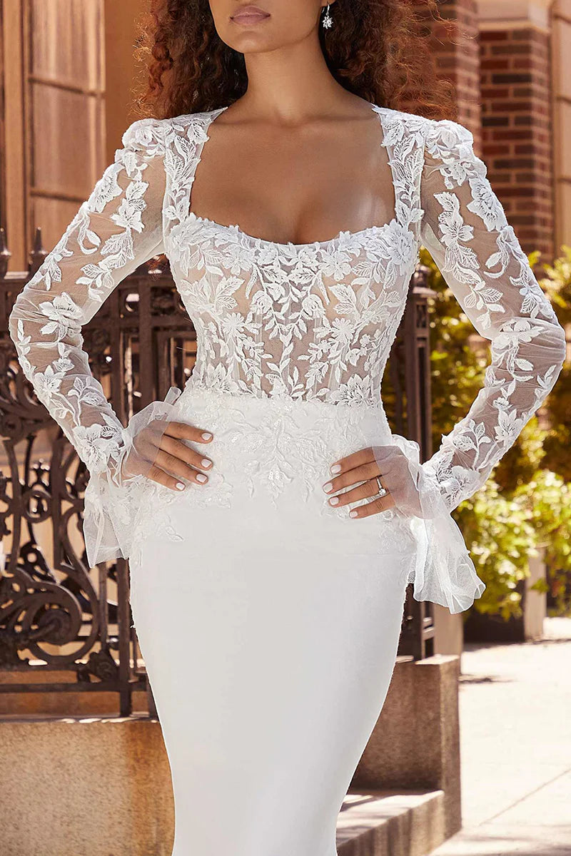 Side profile of a bride wearing a long sleeve mermaid wedding dress.