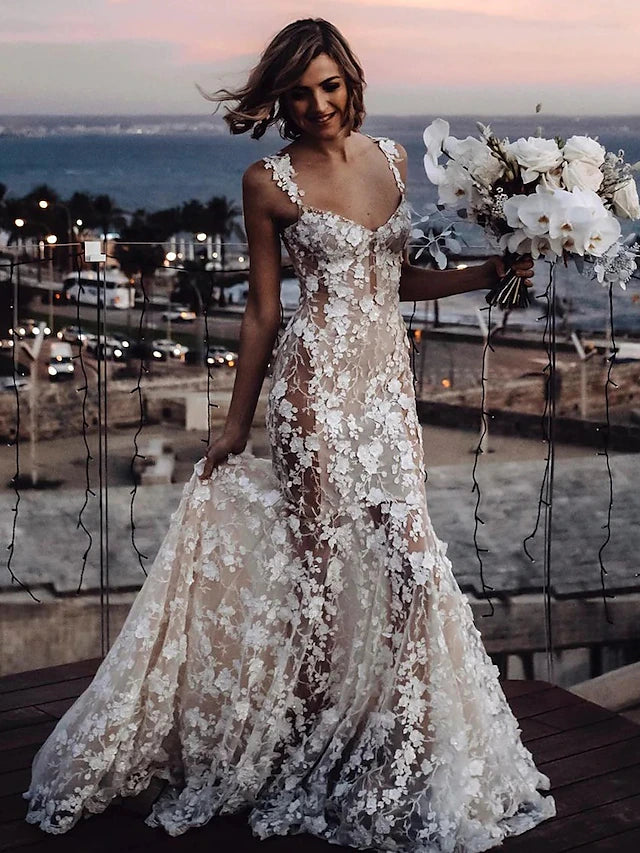 Back view of a Boho wedding dress showing court train and lace details.