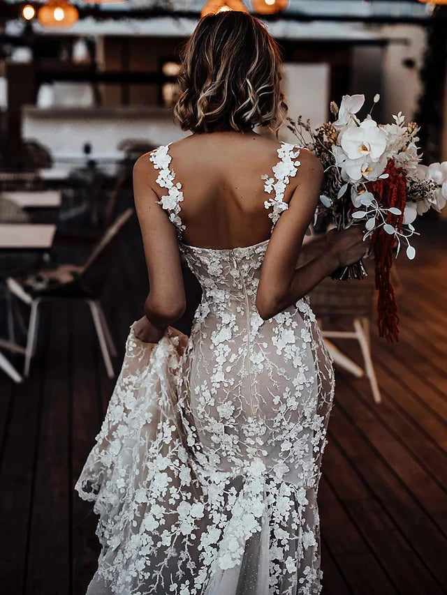 Detail of the lace and appliques on the bodice of the wedding dress.