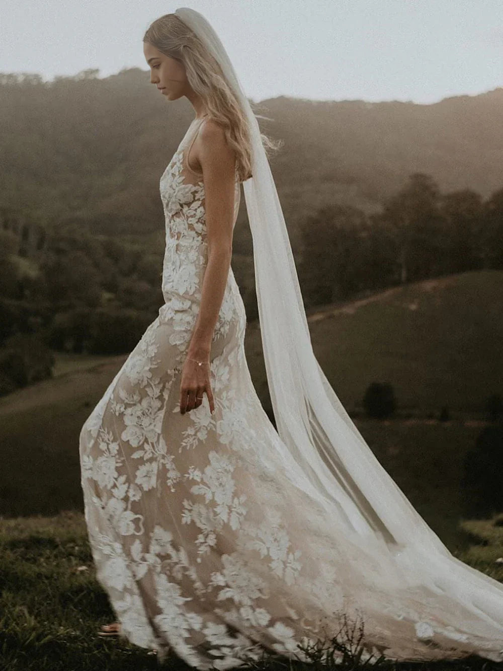 Back view of Boho Mermaid wedding dress showing train and lace details.