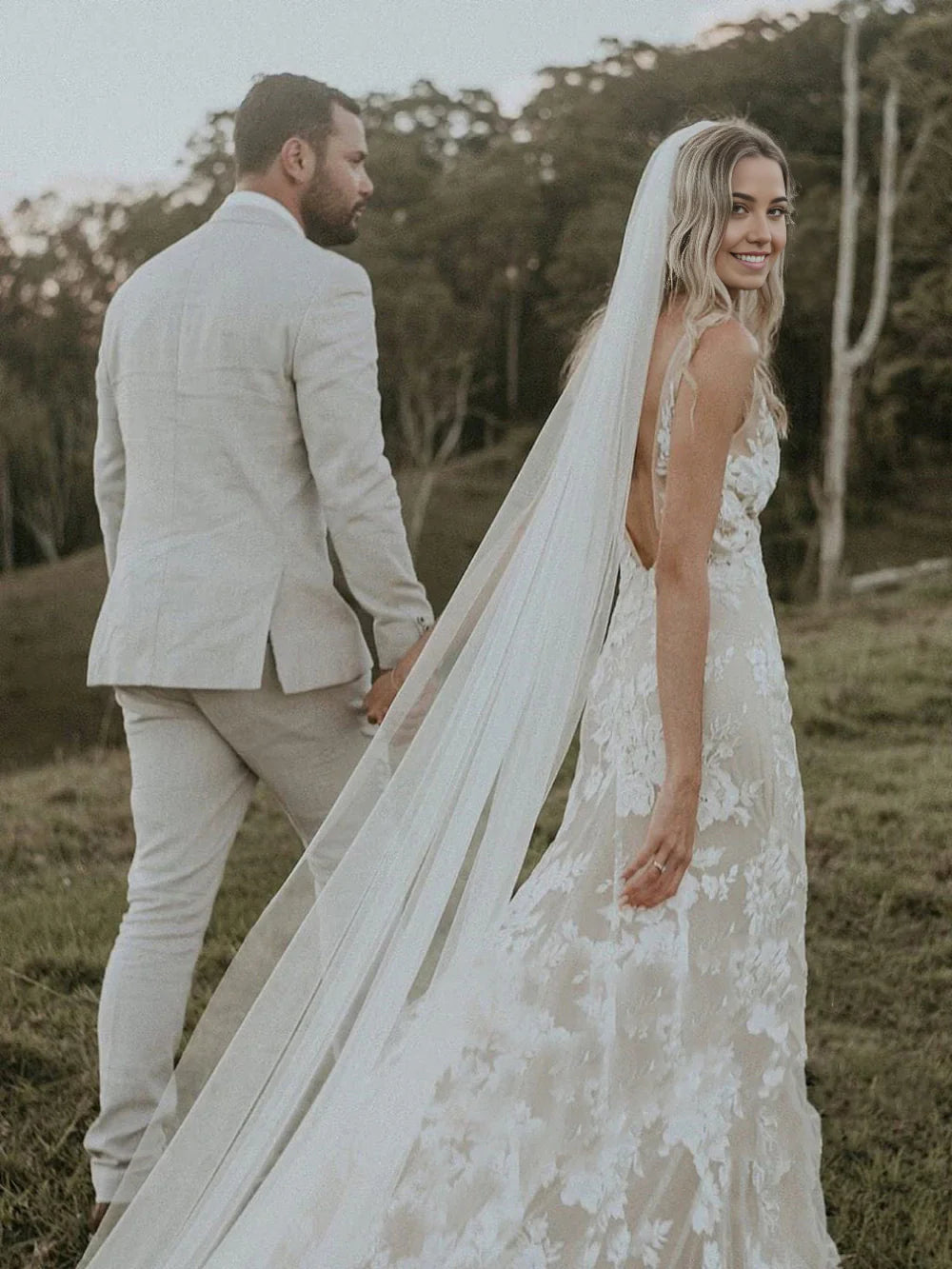 Side view of elegant V Neck mermaid wedding gown with appliques.