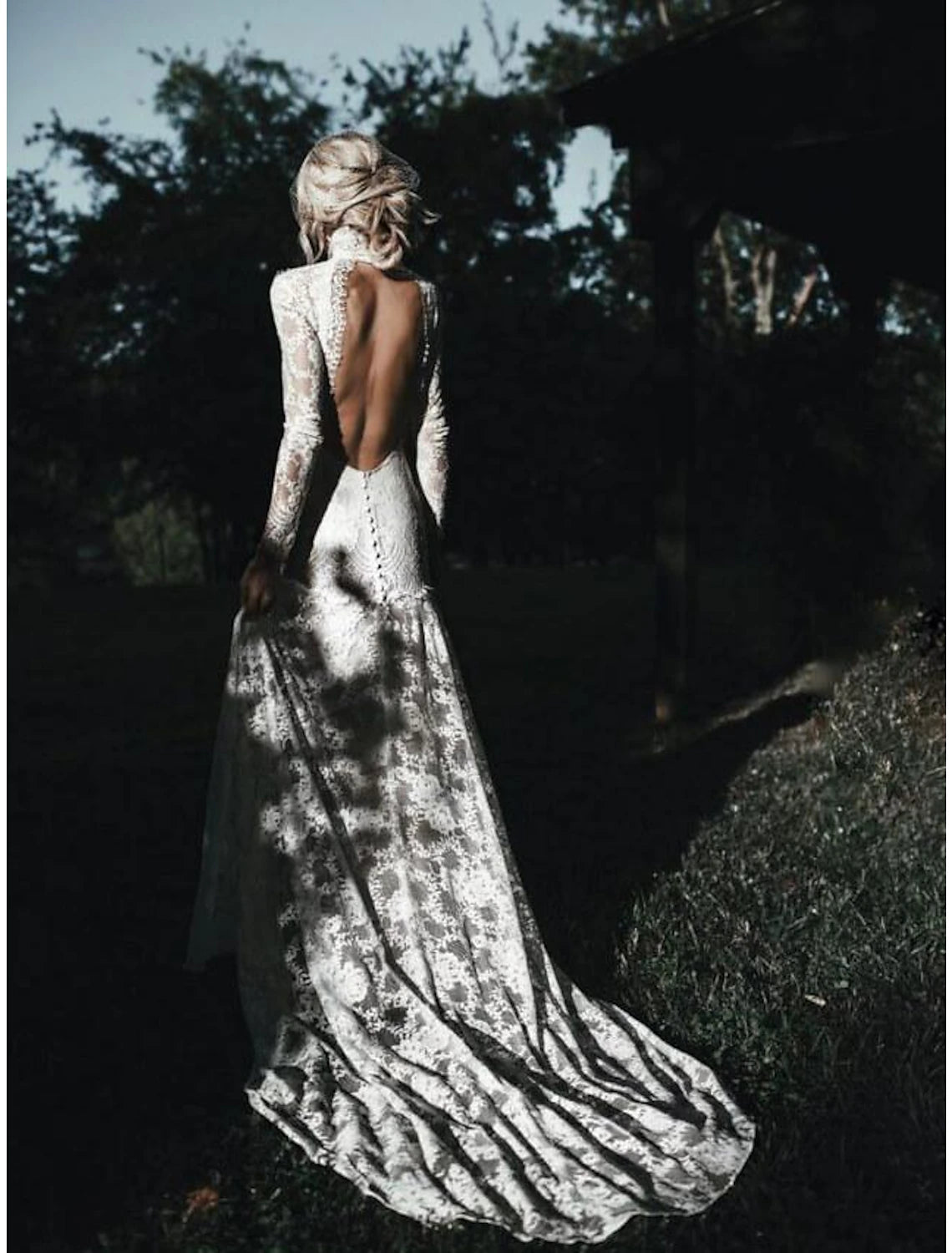 Back view of boho wedding dress showing court train and lace details.