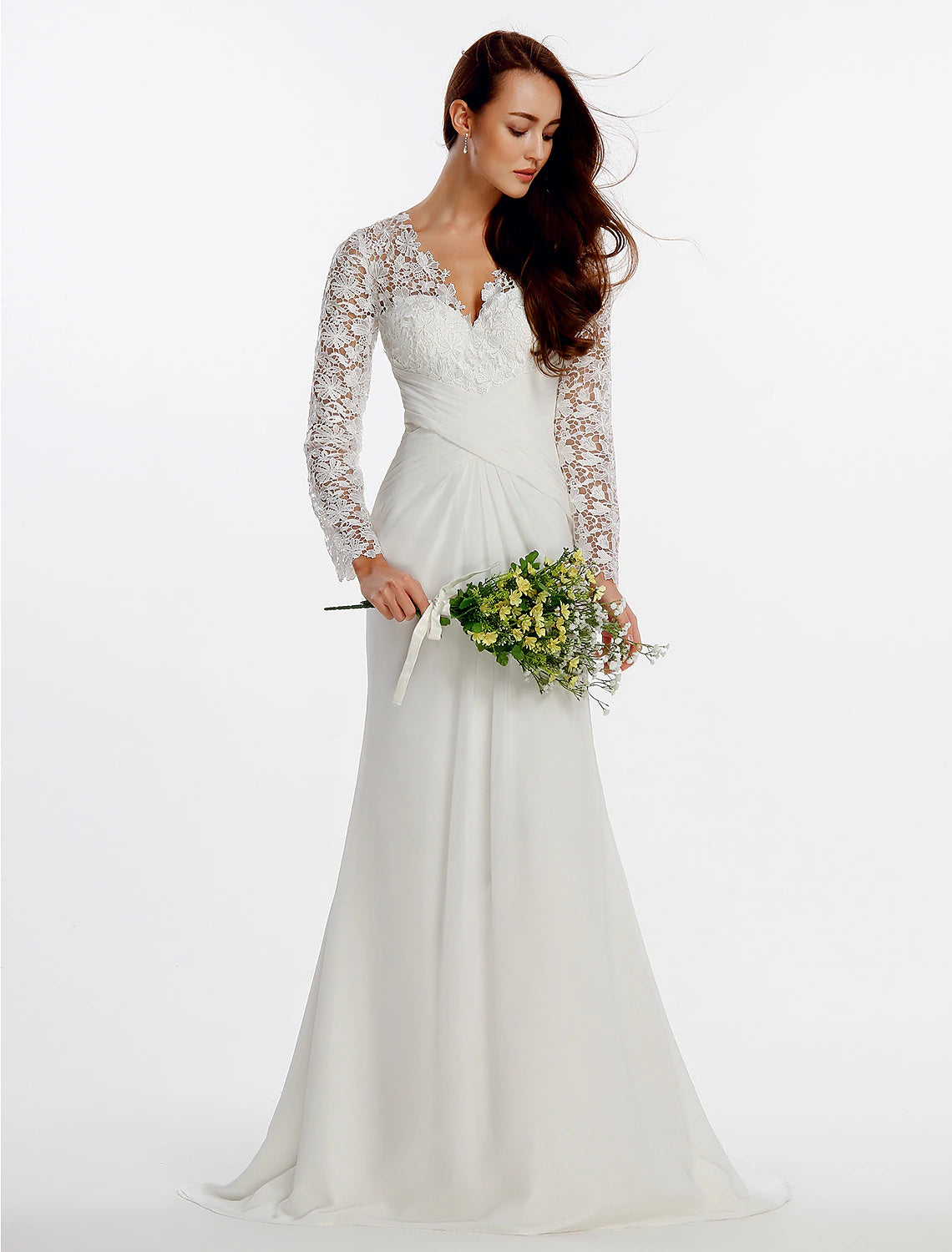 Detail of the lace and button embellishments on the back of a chiffon wedding gown.