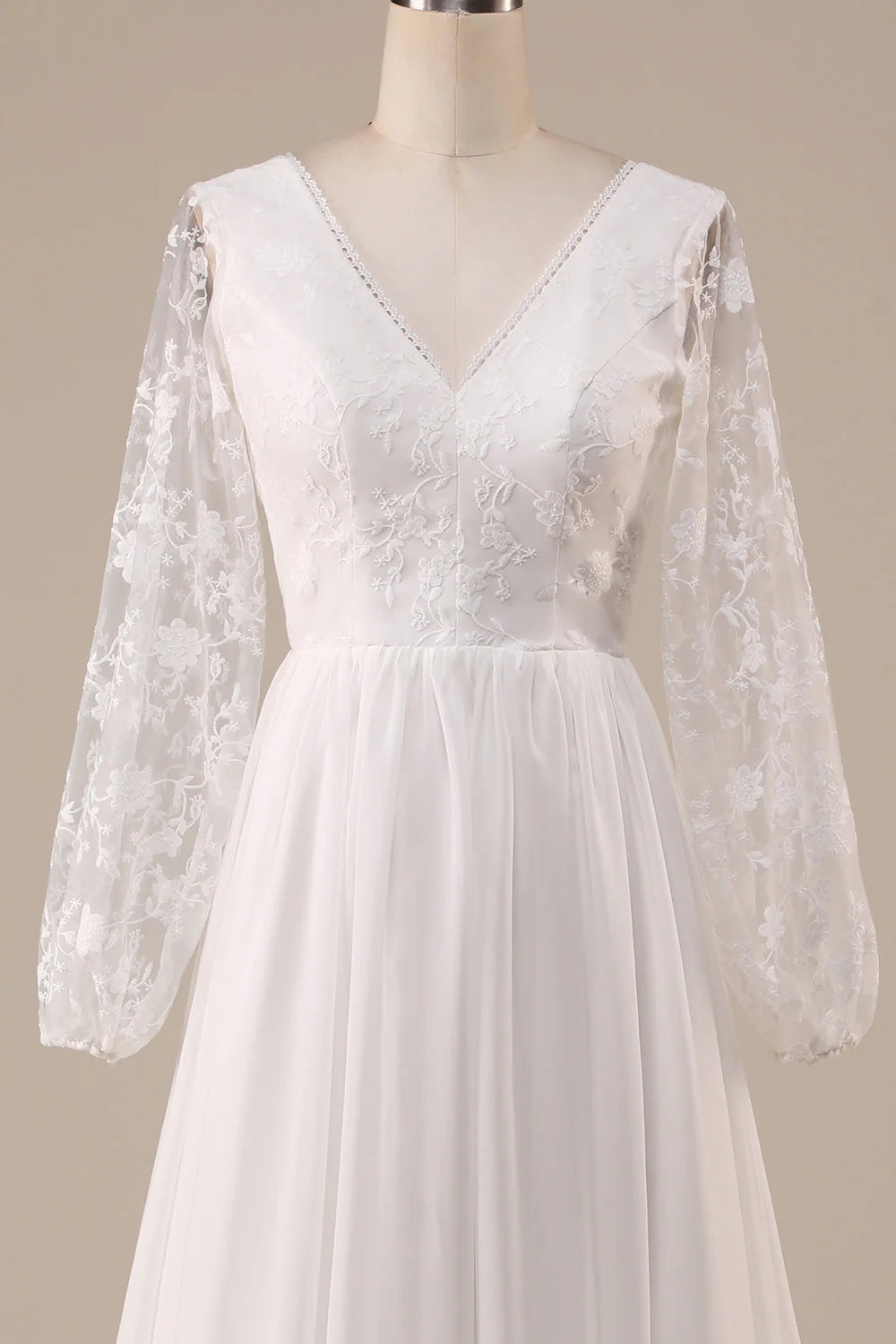 Close-up of intricate lace detail on the bodice of the Ivory Wedding Dress.