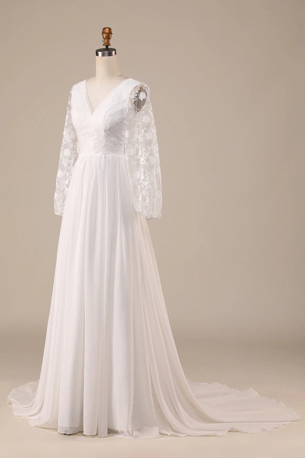 Model showcasing the flowing chiffon skirt of the Ivory A-Line Wedding Dress.