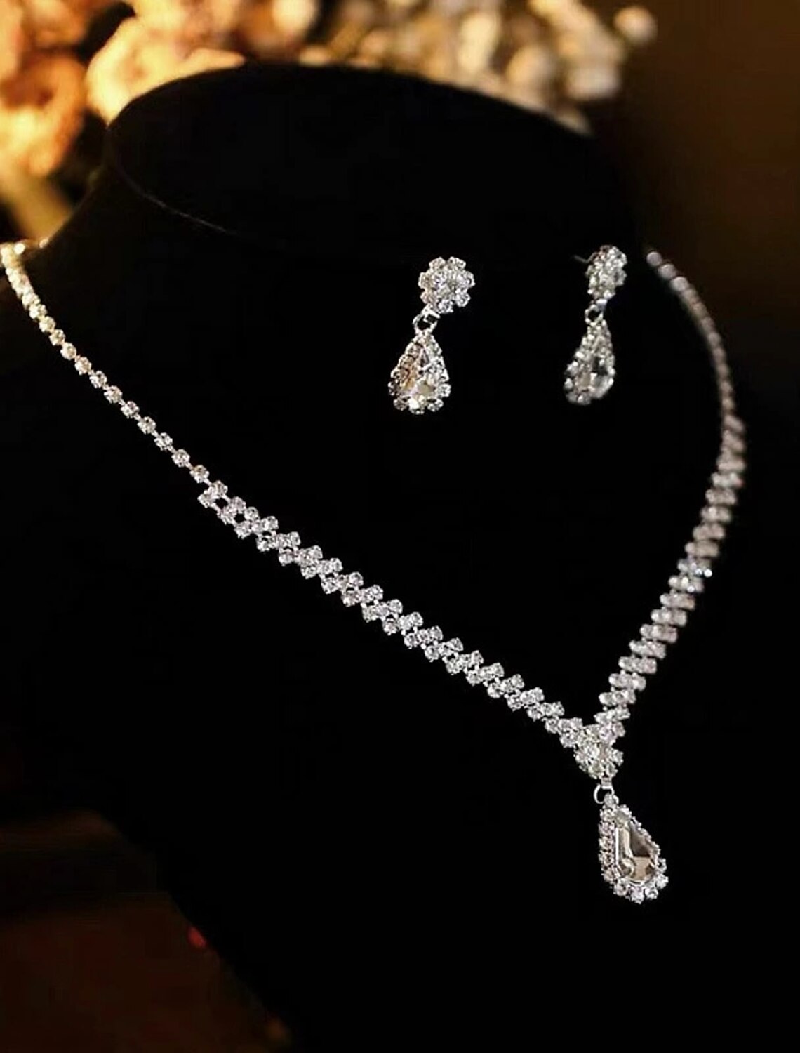 Close-up of the matching alloy briolette drop earrings from the bridal jewelry set.