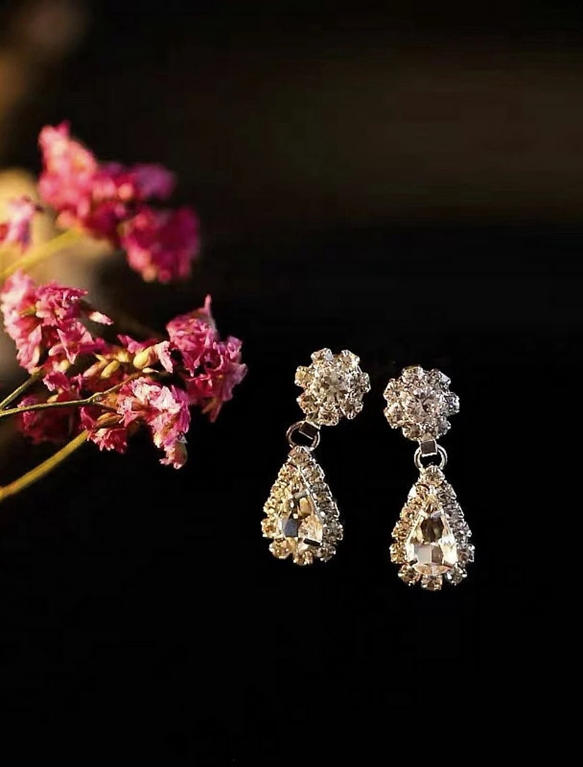 Woman showcasing the elegant bridal jewelry set, including necklace and earrings.